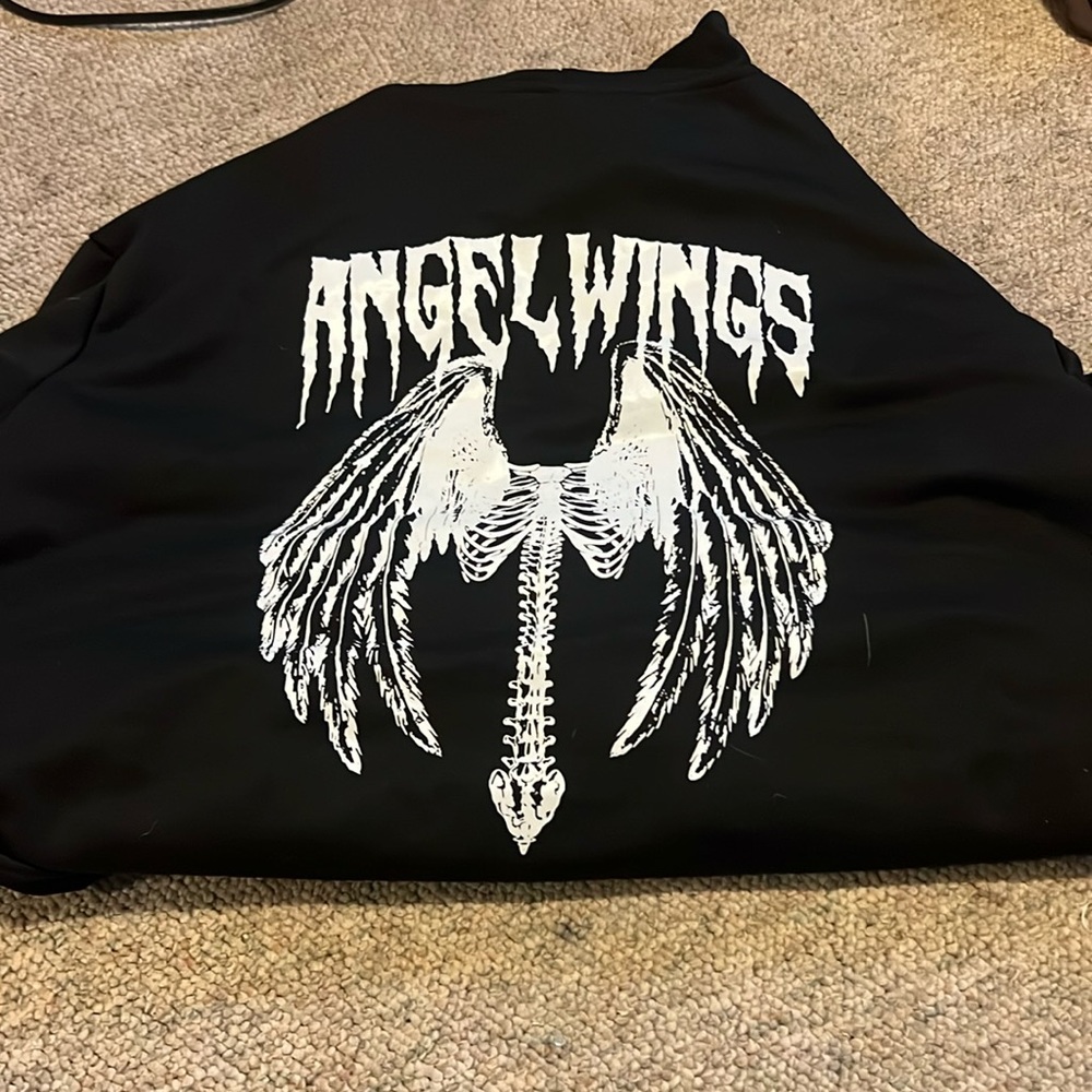 This is a black zip up hoodie from Romwe